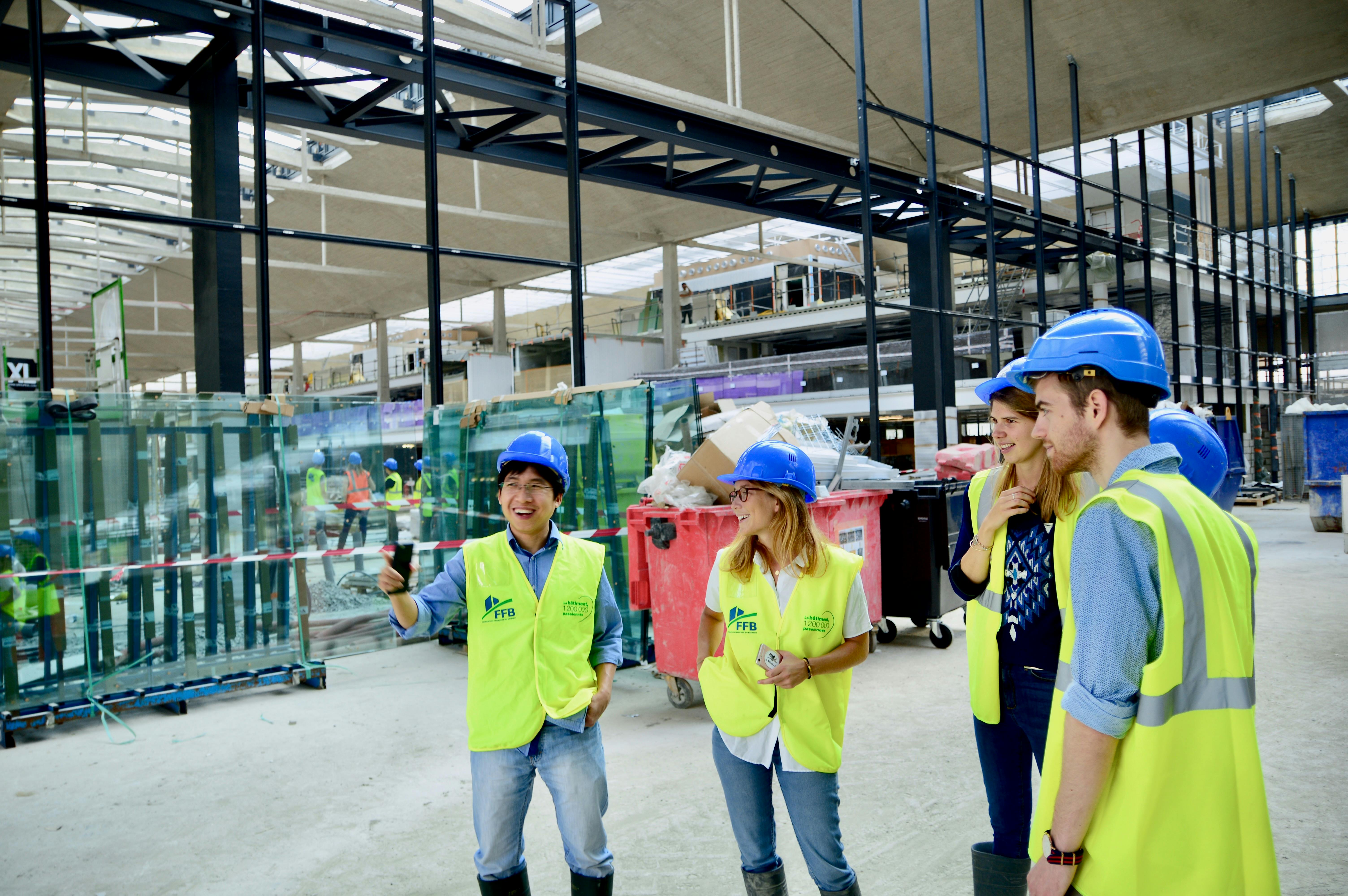 Construction team reviewing project plans on site