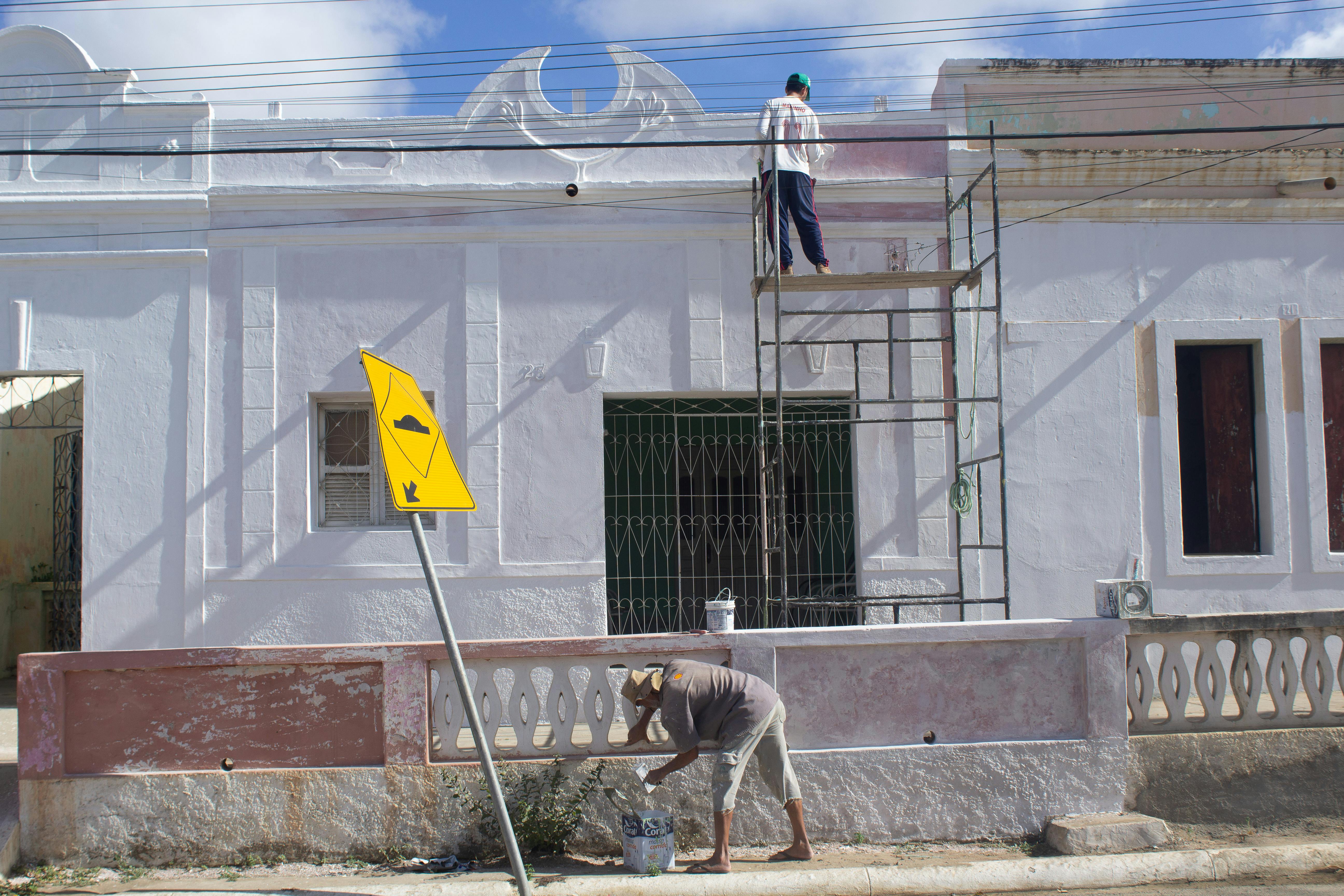 Construction workers handling exterior repair and maintenance