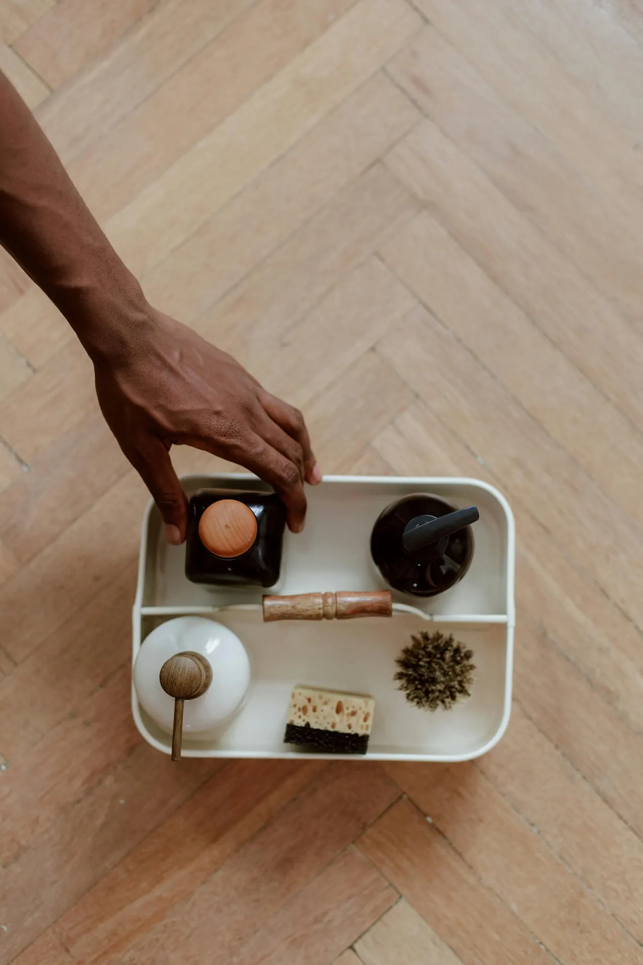 Cleaning supplies arranged in a small tray